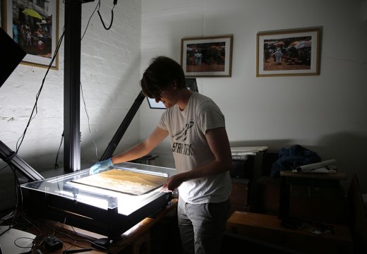British Museum assistant collections manager Jonny Mortemore using the glass plate negative scanner. Courtesy of the Trustees of the British Museum