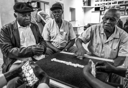 Dominoes being played by first generation migrants in a club in Clapham