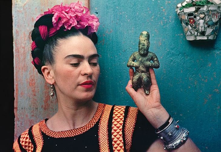 Frida Kahlo with Olmec figurine