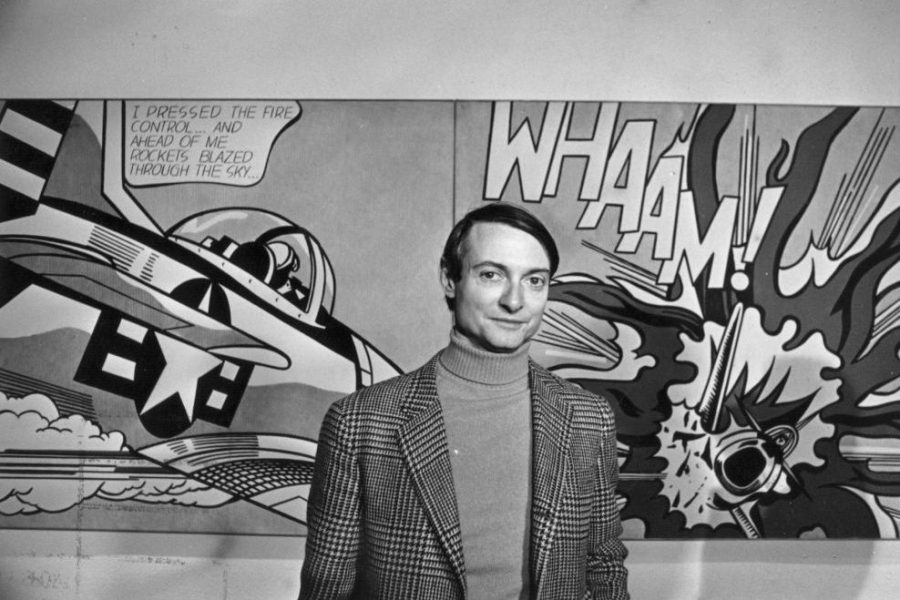 Roy Lichtenstein in front of one of his paintings at the Tate Gallery, London.