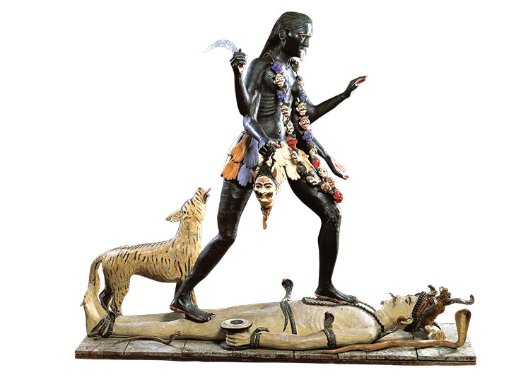 Figure of Kali dancing on Shiva and accompanied by a striped wild animal (c. 1895), Calcutta, India.