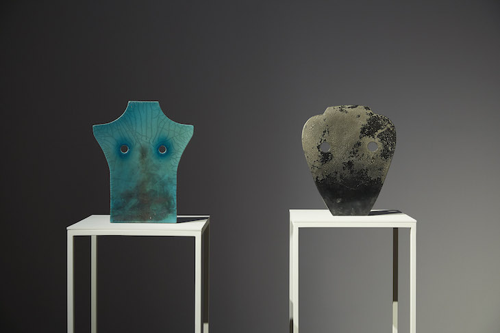 Installation view of Bust Mask Sigilata Black (2018; left) and Bust Mask Copper and Jade I (2018; right) by Pia Camil, Nottingham Contemporary, 2018.