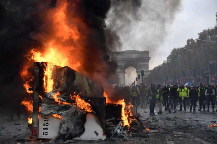 A burnt-out truck on the Champs Elysees in Paris, BERTRAND GUAY/AFP/Getty Images