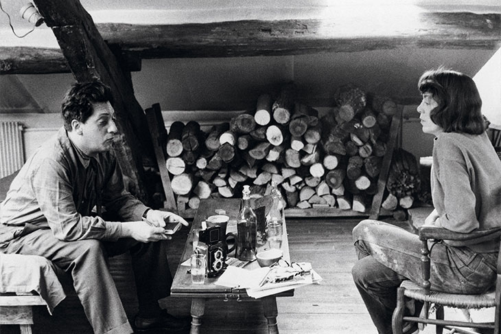 Jean-Paul Riopelle and Joan Mitchell photographed in their apartment-studio on Rue Frémicourt, Paris in 1963.