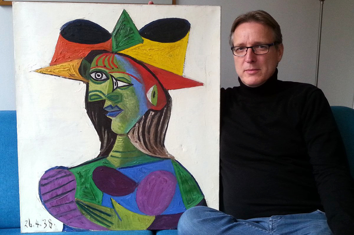 Arthur Brand with the recovered Buste de Femme (1938) by Picasso.