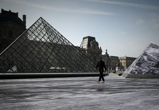 Jean Rene, aka JR walks in the Cour Napoleon of the Louvre Museum as part of the 30th anniversary celebrations of the Louvre Pyramid, Photo: Philippe Lopez/AFP/Getty Images
