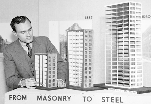 Philip Johnson with models showing ‘the evolution of the modern skyscraper’, shortly before their display at the Museum of Modern Art, New York, in 1933.