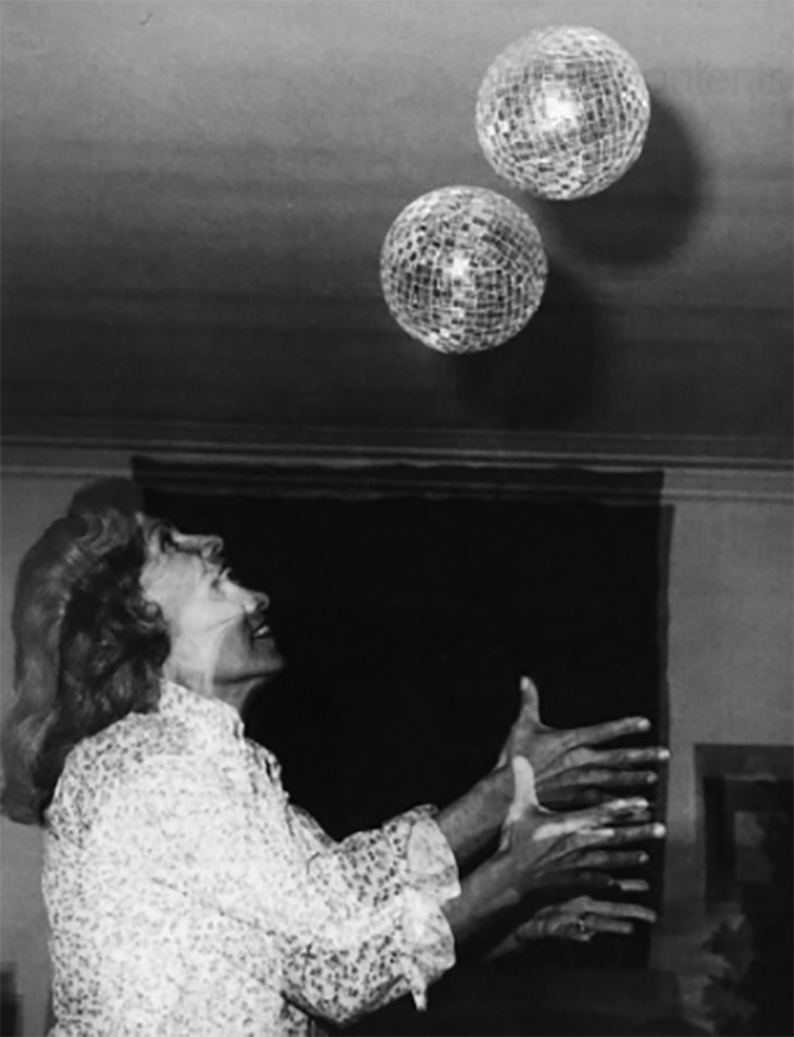Monir Shahroudy Farmanfarmaian with disco balls at the salon of her home in Tehran, 1977.
