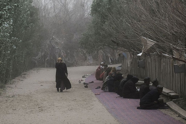 Pilgrims praying at the tomb of Imam Asim in Hotan, Xinjiang, in April 2015. According to a recent report the site has since been demolished.