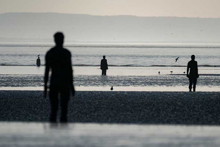 Antony Gormley’s ANOTHER PLACE at Crosby beach in 2019.