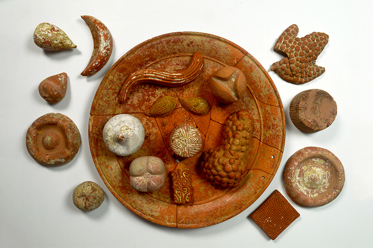 Terracotta votive food: pomegranates (open and closed); grapes; figs; almonds; cheeses; focaccia;