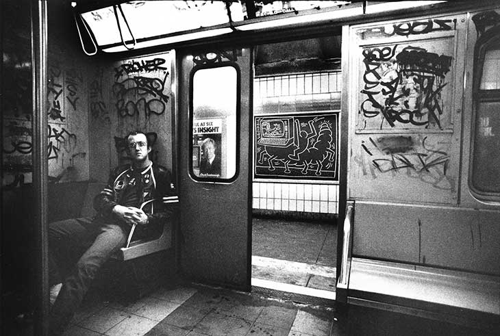 Keith Haring in a subway car in New York (c. 1983), Tseng Kwong Chi.