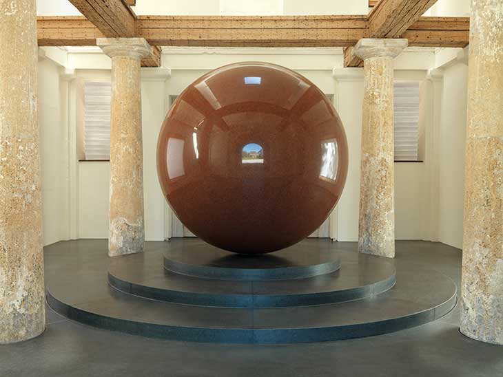 Installation view of Large Red Sphere (2010) by Walter De Maria in the Türkentor, Munich.
