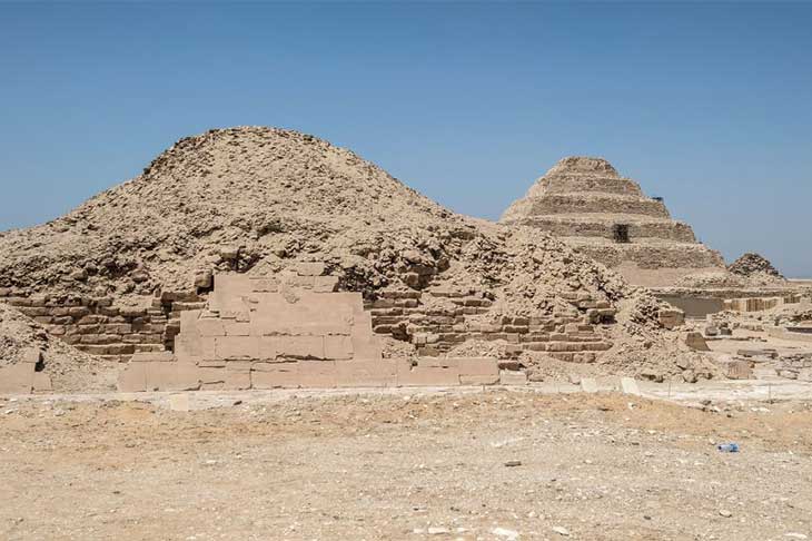 The pyramids in the Saqqara necropolis, with the Pyramid of Unas in the foreground and the Step Pyramid of Djoser in the background.