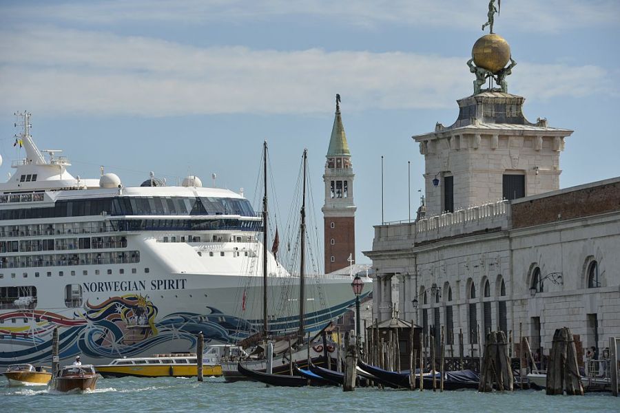 A cruise ship passes close to the church San Giorgio Maggiore, in Venice on 26 September 2014.
