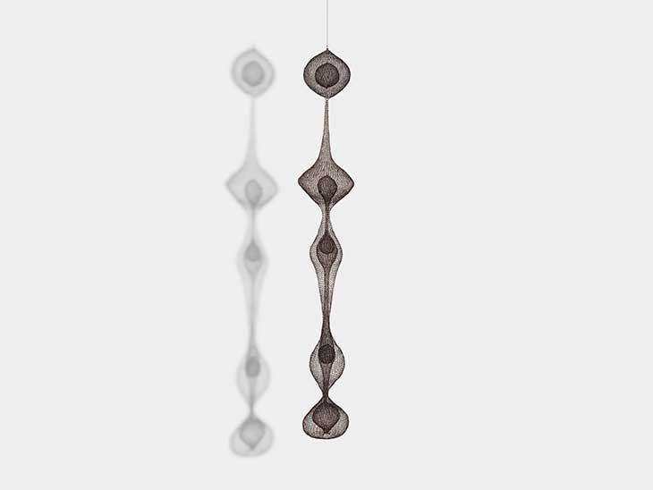 Untitled (S.535, Hanging Five-Lobed Continuous Form within a Form with Two Interior Spheres and One Teardrop Form) (1951), Ruth Asawa.