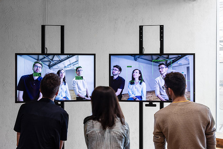 Installation view of ‘Kate Crawford, Trevor Paglen: Training Humans’ at Fondazione Prada, Milan, 2019. On the right-hand screen is Paglen’s ImageNet Roulette (2019).