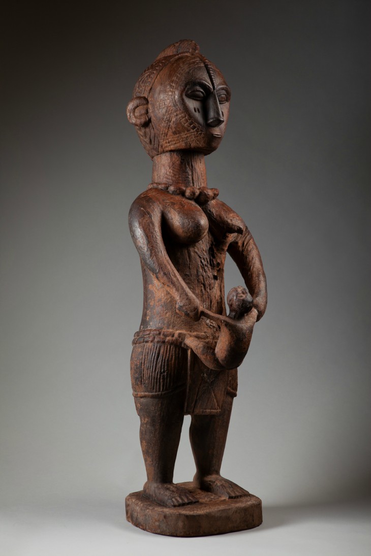 A-tekan Woman's society maternity figure with child (c. 1930)
