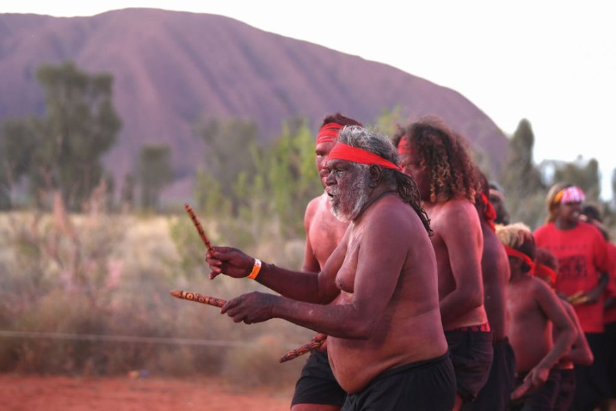 Anangu members perform a dance during a ceremony marking the permanent ban on climbing Uluru on 27 October 2019.