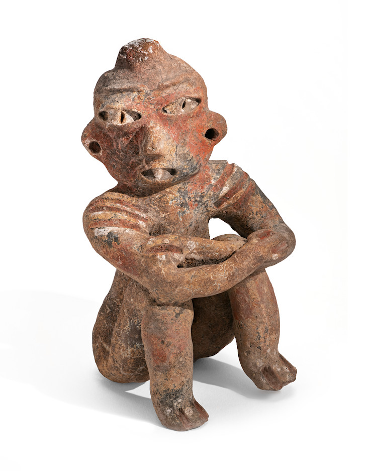 Seated male with shoulder scarification (1200–900 BC), possibly Tlatilco.