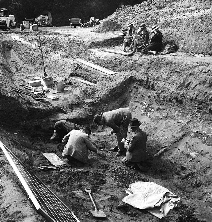 Edith Pretty (in a cane chair) observing the excavations at Sutton Hoo in 1939.