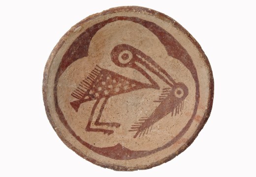 Red-on-buff plate with a bird holding a fish in its beak, c. 900–1150, Sacaton, Arizona. Arizona State Museum