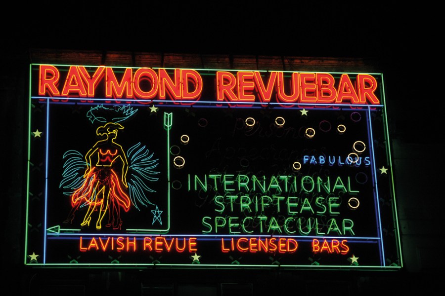 Neon sign made in the 1950s for Raymond Revuebar in Soho, London, photographed in 2015 after restoration and reinstallation.