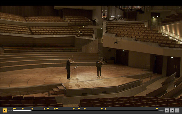 Screenshot showing Episode 3 of the Easter@Philharmonie Festival. Noah Bendix-Balgley and Daishin Kashimoto, first concert masters of the Philharmoniker, play a movement from Prokofiev’s Sonata for Two Violins to an empty Philharmonie