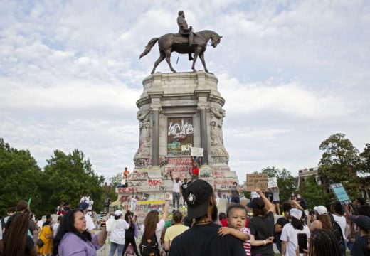 People gather around the Robert E. Lee statue on Monument Avenue in Richmond, Virginia, on June 4, 2020. Earlier, Virginia governor Ralph Northam announced plans to remove the statue of the Confederate general. Photo: Ryan M. Kelly/AFP via Getty Images