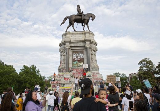 People gather around the Robert E. Lee statue on Monument Avenue in Richmond, Virginia, on June 4, 2020. Earlier, Virginia governor Ralph Northam announced plans to remove the statue of the Confederate general. Photo: Ryan M. Kelly/AFP via Getty Images