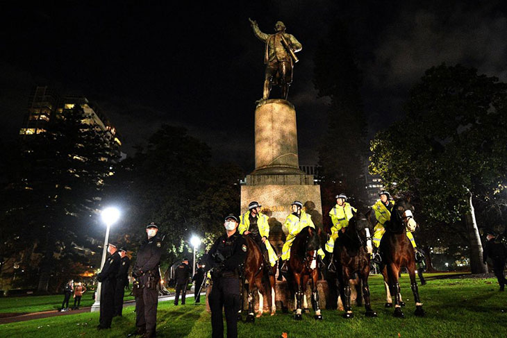 Police guarding the statue of Captain Cook in Hyde Park during a Black Lives Matter protest in Sydney in June 2020.