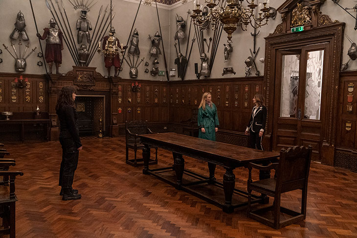 Villanelle meets The Twelve’s representatives at the Armourers’ Hall.