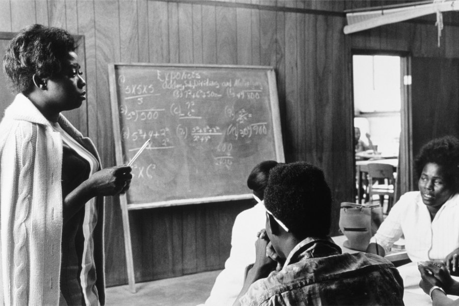 A volunteer mathematics teacher with students at Tufts, Mound Bayou, Mississippi (1968), Doris Derby.