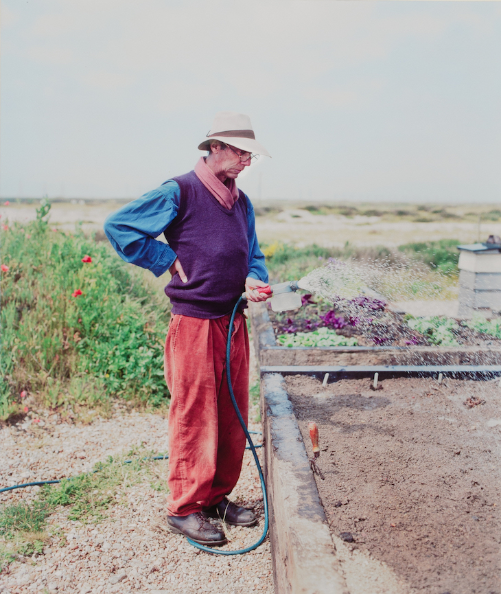 Derek Jarman at Prospect Cottage (c. 1990).