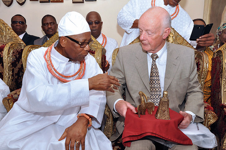 Prince Edun Akenzua and Mark Walker with two Benin bronzes returned at a ceremony in Benin City, Nigeria, on 20 June 2014.