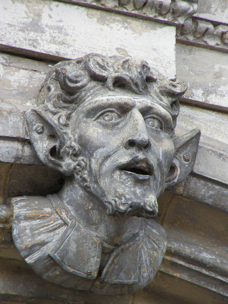 A grotesque face, said to represent Oliver Cromwell, on the facade of the early 18th-century Guidhall, Worcester.