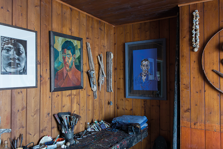 The interior of Prospect Cottage, showing artworks and natural and salvaged objects