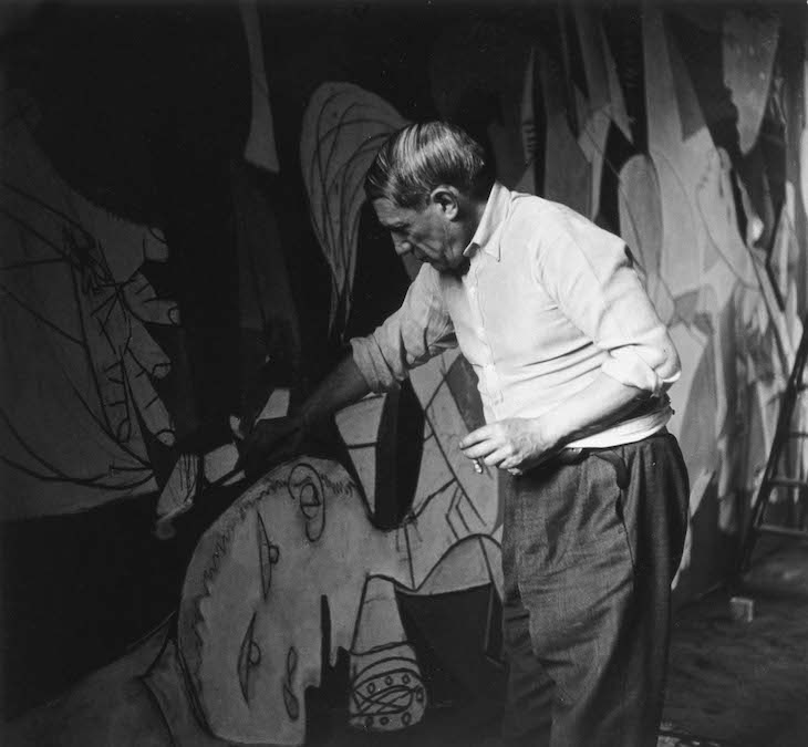 Picasso working on Guernica in his studio at Grands-Augustins, Paris (1937), Dora Maar.