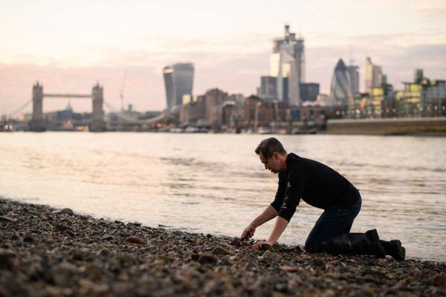 Bank vault: mudlarker Jason Sandy on the foreshore of the River Thames.