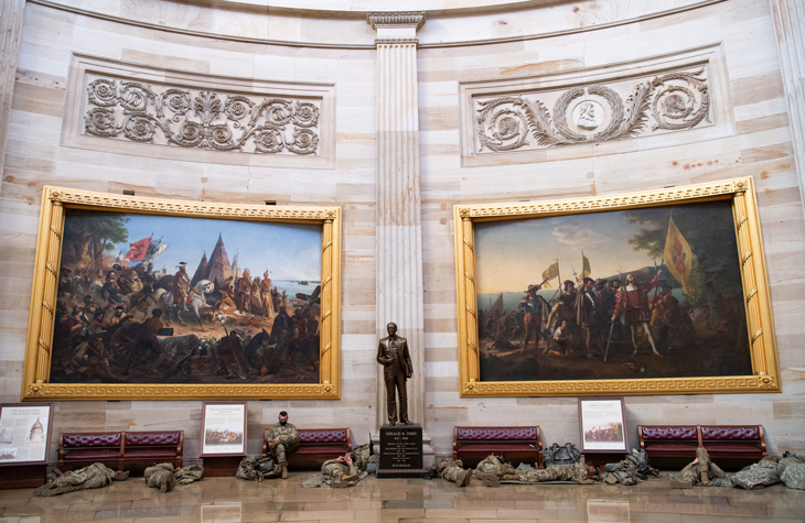Members of the National Guard resting in the Capitol Rotunda on January 13, 2021, before the House vote to impeach President Trump for a second time.