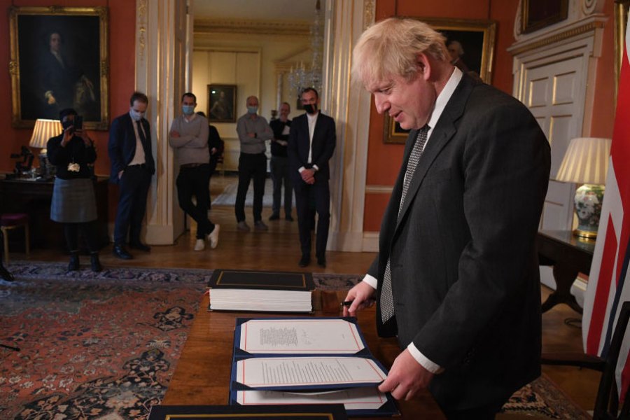 No more red tape? Boris Johnson signs the Brexit deal in December 2020.