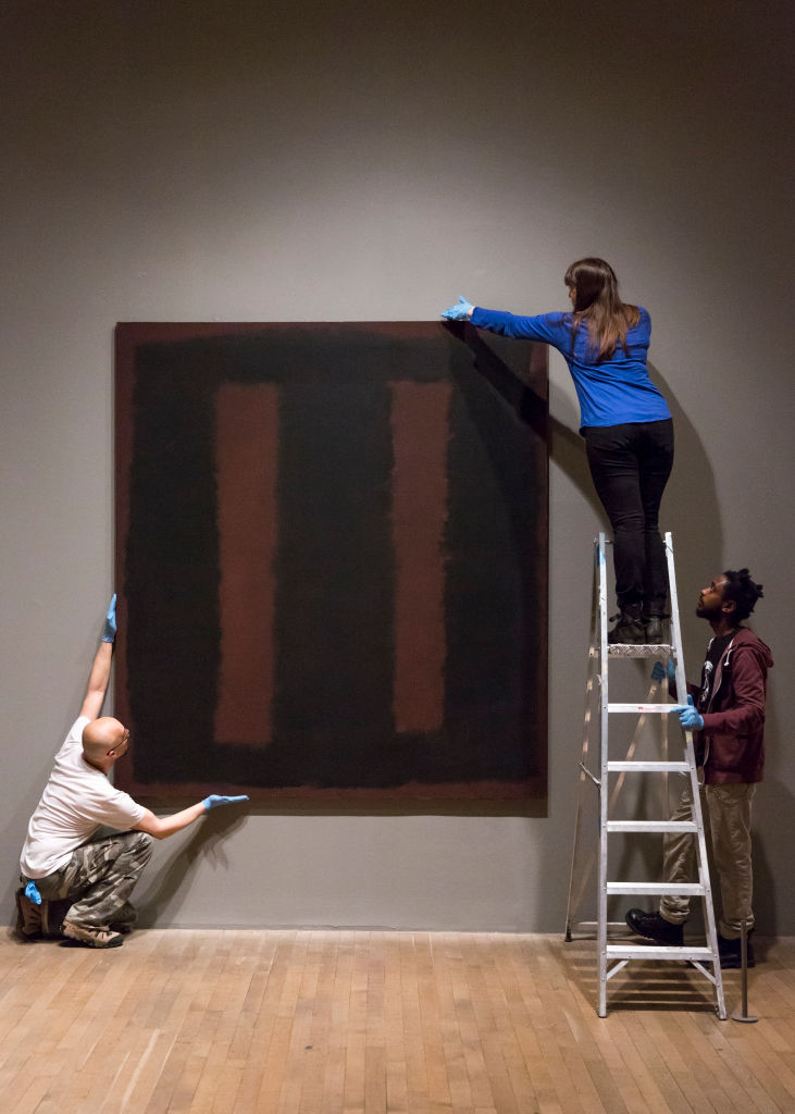 One of Mark Rothko’s Black On Maroon paintings from 1958 being installed at Tate Modern, London (they currently hang in Tate Britain).