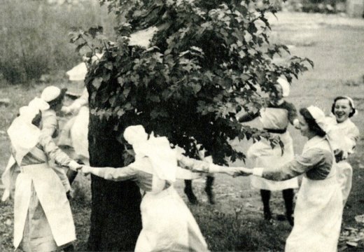 Nurses dance around the Bethnal Green mulberry in 1944, three years after it was bombed.