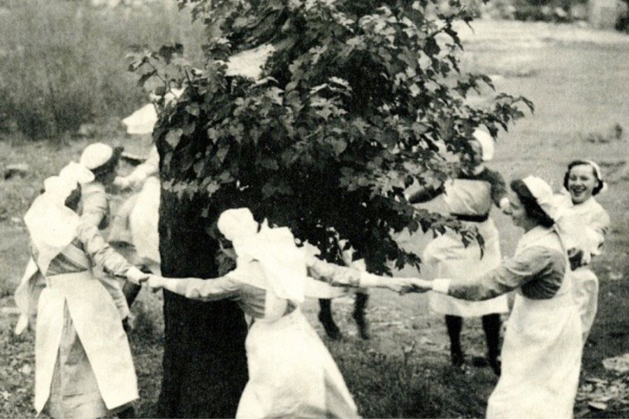 Nurses dance around the Bethnal Green mulberry in 1944, three years after it was bombed.