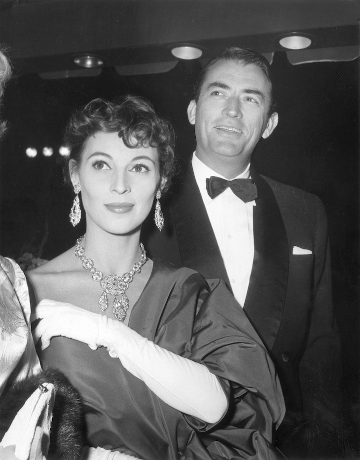 Véronique and Gregory Peck and his wife at the premiere of director Nunnally Johnson's film, 'The Man in the Gray Flannel Suit' (1956). 