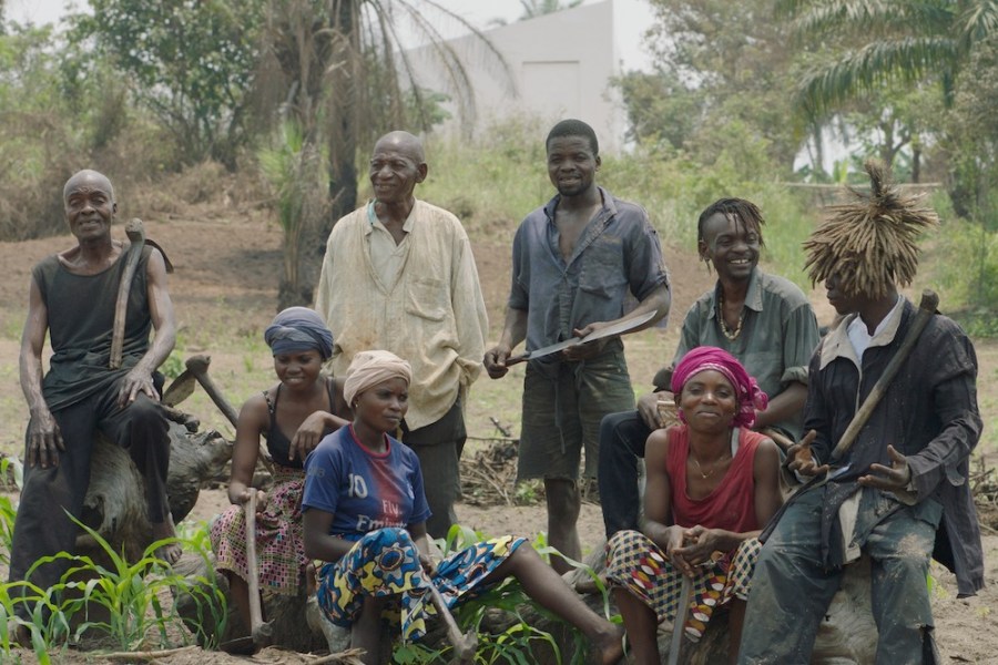 The Cercle d'Art des Travailleurs de Plantation Congolaise standing before the White Cube in Lusanga