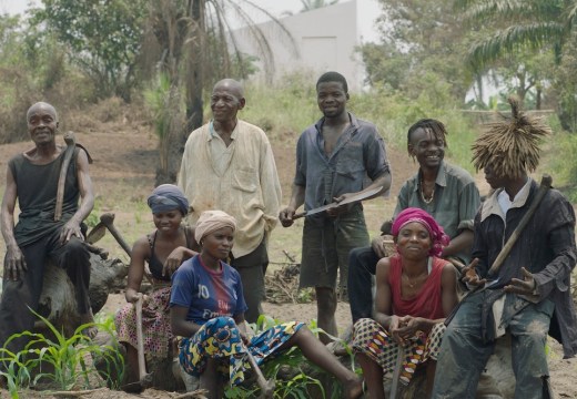 The Cercle d'Art des Travailleurs de Plantation Congolaise standing before the White Cube in Lusanga