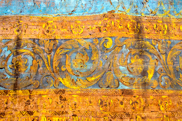 The original 18th-century stage curtain, painted to imitate gold-embroidered blue velvet