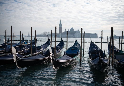 In hibernation: covered gondolas line the shore in Venice in December 2020.