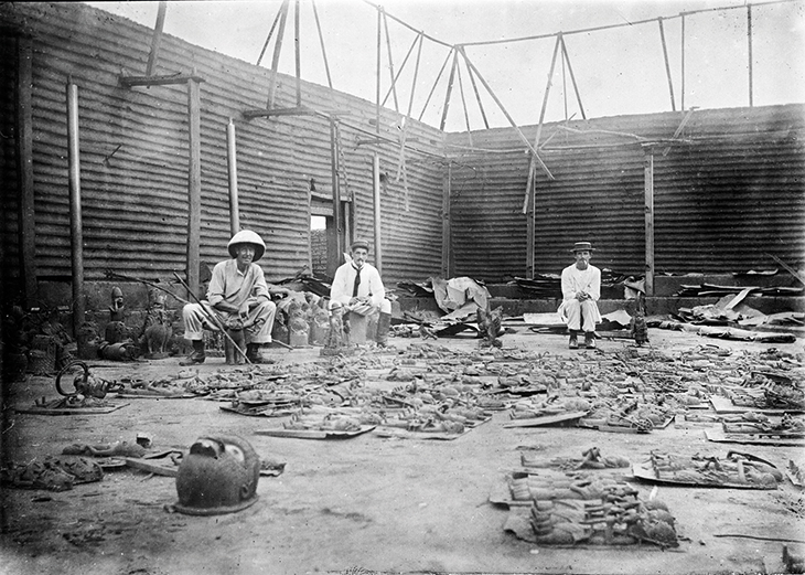 Soldiers with the British punitive expedition of February 1897 photographed by Reginald Granville Kerr in the Benin palace compound, Benin City, in 1897.